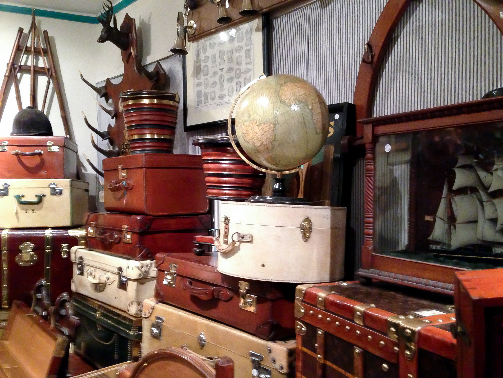 Vintage and antique globes and suitcases at Henry Gregory in London. Photo by alphacityguides.
