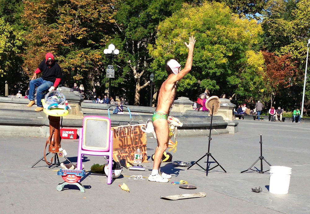 Eclectic street performer in Washington Square Park in New York. Photo by alphacityguides.