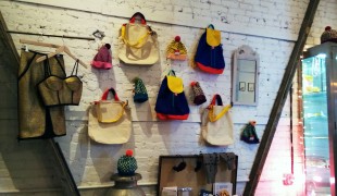 Backpack accessory wall at American Two Shot in New York. Photo by alphacityguides.