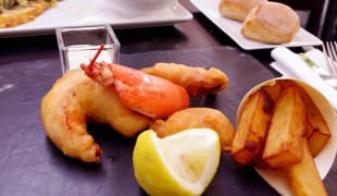 Lobster fish and chips at Publicis Drugstore Brasserie in Paris. Photo by alphacityguides.