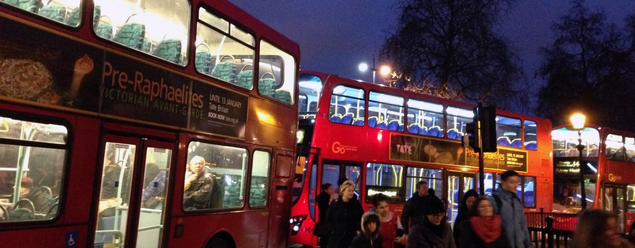 Big red double decker bus in London. Photo by alphacityguides.