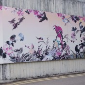 Mural at the Bird Market in Hong Kong. Photo by alphacityguides.
