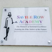 Savile Row Academy Sign on Savile Row in London. Photo by alphacityguides.