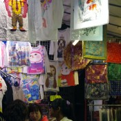 T-shirts at the Temple Street Market in Hong Kong. Photo by alphacityguides.