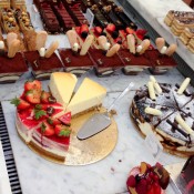 Cake and pastry diplay at Harrods in London. Photo by alphacityguides.
