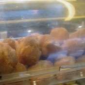 Sugared doughnut display at Tai Cheong Bakery in Hong Kong. Photo by alphacityguides.